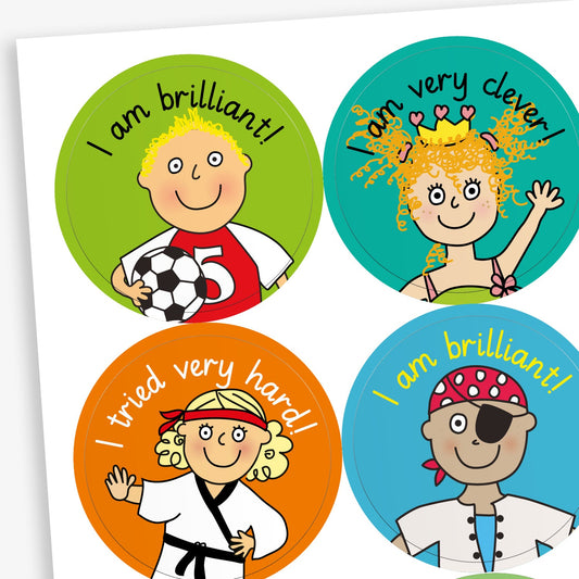 A sheet of circular motivational stickers for children featuring cartoon characters and positive affirmations. Messages include 'I am brilliant!' with a smiling boy holding a football, 'I am very clever!' with a girl wearing a crown, 'I tried very hard!' with a child in a karate uniform, and another 'I am brilliant!' with a cheerful pirate character. Each sticker has a bright background in colours like green, teal, orange, and blue.