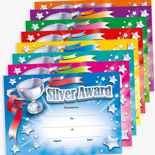 Certificates in various bold colours including cyan, magenta, yellow, green, red and purple, display the title 'Silver Award'. Designated spaces for the recipient's name, reason for the award, where received, date, and signature.  Each certificate has a silver trophy in the top left corner with a ribbon from each handle.  The centre replicates a starburst with stars eminating from it around the borders.