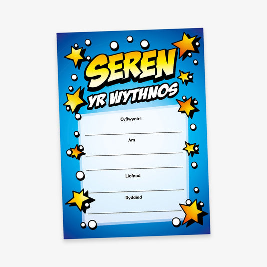 Bright blue Welsh-language certificate titled 'Seren Yr Wythnos' with a comic-style design featuring bold text, cartoon stars, and white bubbles. Includes fields for recipient name, reason, signature, and date.