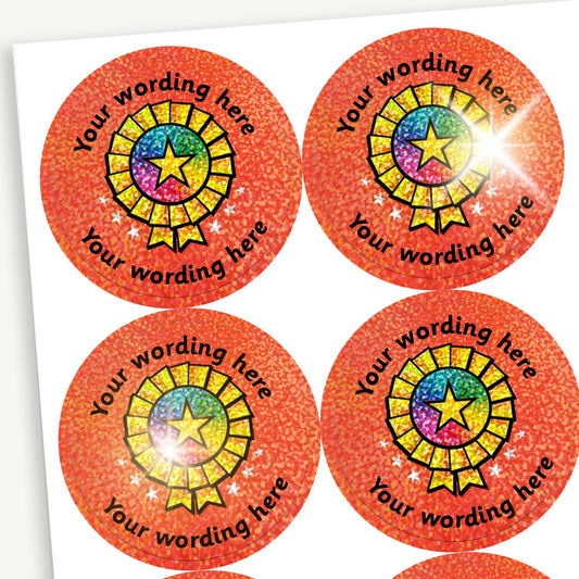 Sheet of round orange holographic stickers featuring a shining gold rosette with a rainbow and star in the centre. Each sticker has placeholder text reading 'Your wording here' curved above and below the illustration for customisation.