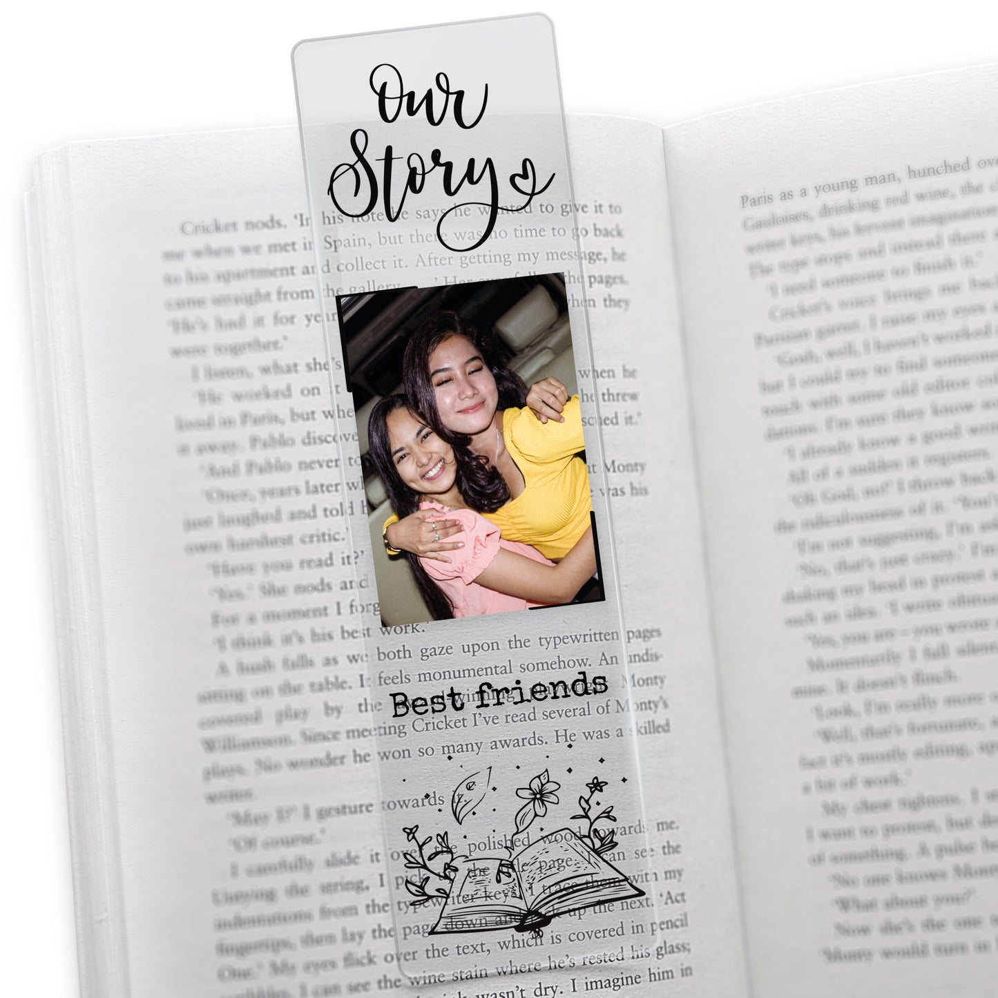 Clear acrylic friendship-themed bookmark featuring the phrase 'Our Story' at the top, a photo of two friends hugging, and the words 'Best friends' in black font above an illustrated open book with botanical elements.