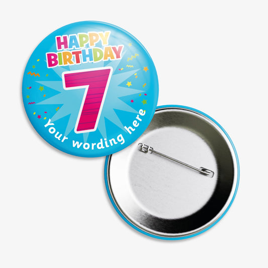 A set of ten 38mm round badges with a vibrant blue background, featuring the phrase "Happy Birthday" in multicoloured letters above a large, bold pink number "7"; includes a customisable text area below the design and a safety pin backing.