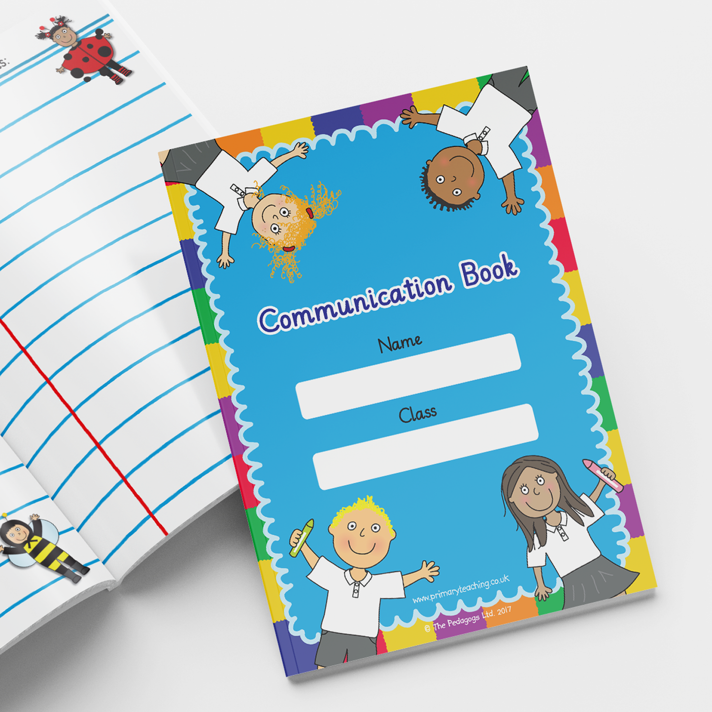 Colourful 'Communication Book' with a bright blue cover framed by a rainbow border and cartoon illustrations of smiling children holding pencils. The cover includes spaces labelled 'Name' and 'Class'. An open page beside it features wide-ruled lines with cartoon images of a ladybird and a bee.