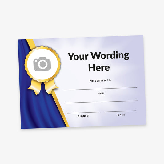 Customisable certificate with a blue and silver design featuring a gold rosette on the left side. Includes placeholder text 'Your Wording Here' and blank fields for 'Presented To', 'For', 'Signed', and 'Date'. A circular image placeholder is set within the rosette.