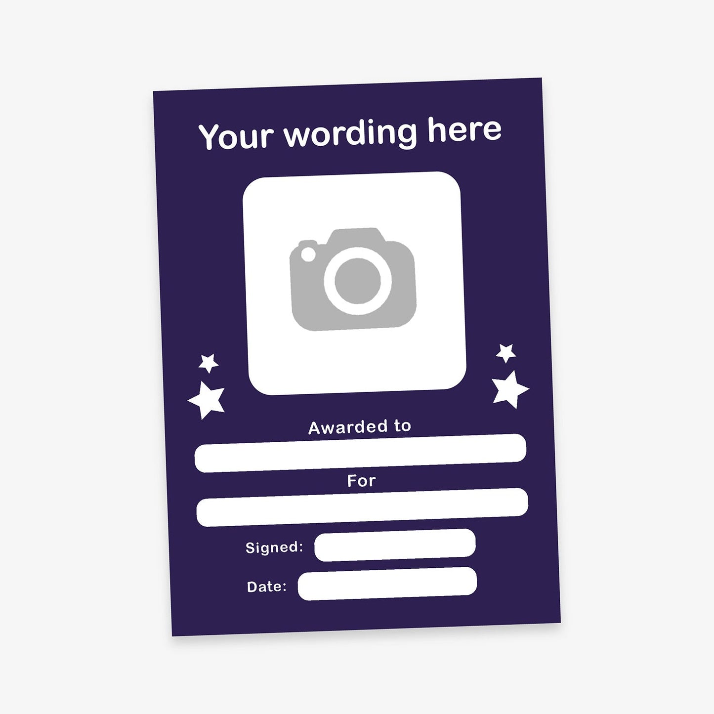 Customisable award certificate with a dark purple background and white text. Includes placeholder text 'Your wording here' at the top, a square area for an image, and blank fields labelled 'Awarded to', 'For', 'Signed', and 'Date'. Decorative stars surround the image area.