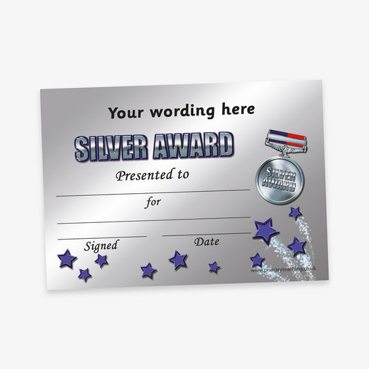 A silver-themed award certificate with a metallic background. The heading reads 'Your wording here' followed by bold, stylised text 'SILVER AWARD'. There is a silver medal graphic with a red, white, and blue ribbon on the right, labelled 'SILVER AWARD'. The certificate includes blank lines for 'Presented to:', 'For:', 'Signed:', and 'Date:'. Blue and purple stars trail across the bottom right corner.