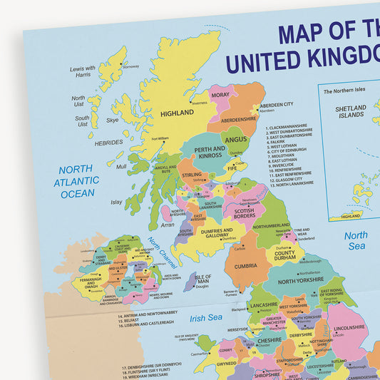 Colourful educational map of the United Kingdom displaying counties and regions of England, Scotland, Wales, and Northern Ireland. Major cities and bodies of water like the North Atlantic Ocean and Irish Sea are labelled.