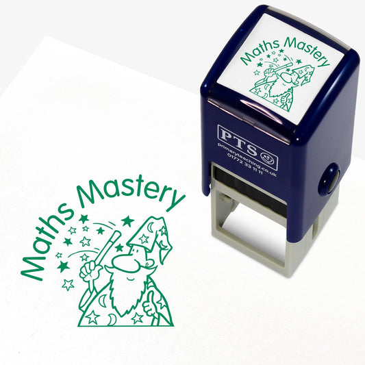 A 25mm self inking stamper with green ink showing a wizard with a wand emitting a shower of start and the phrase arcing to the left saying 'Maths Mastery'
