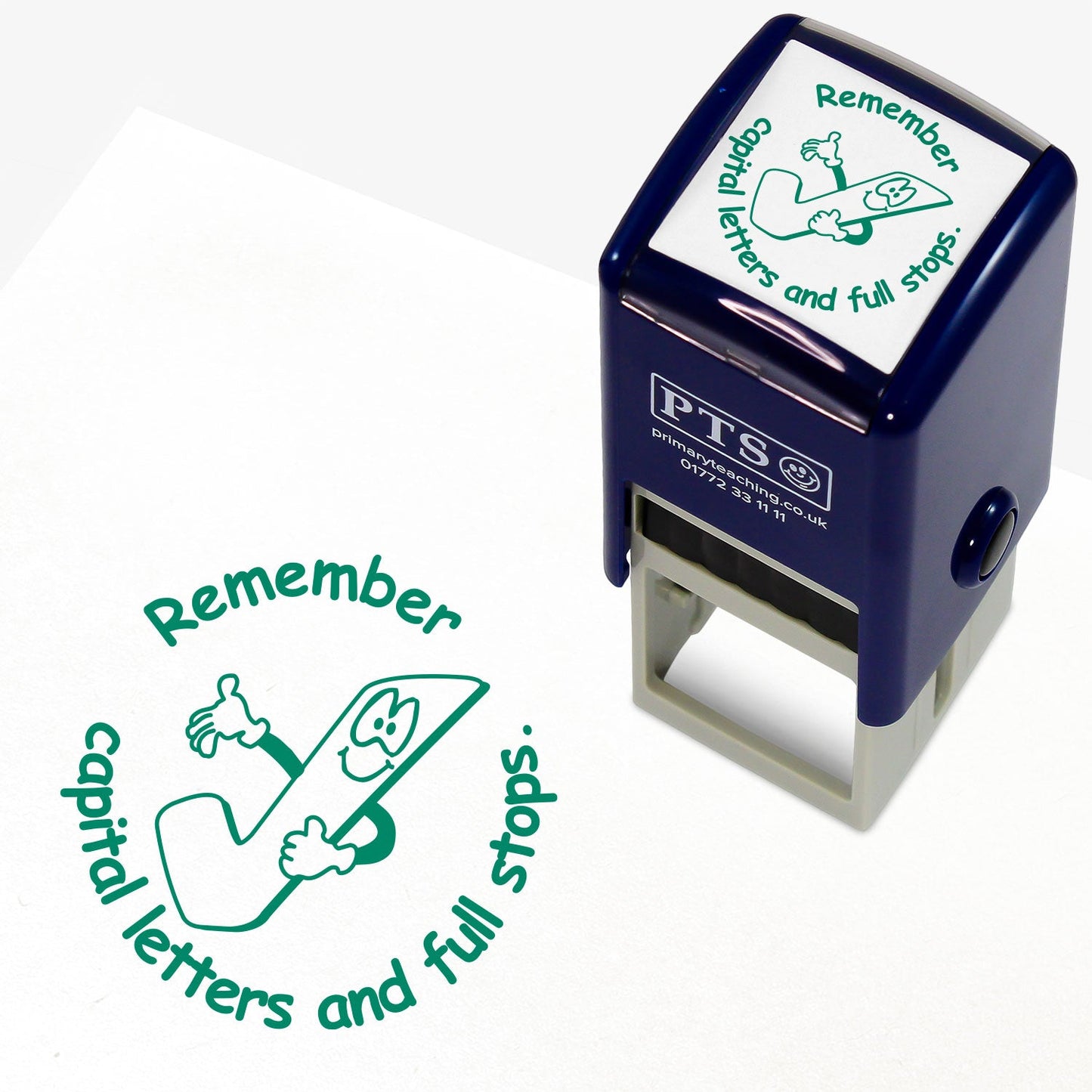 A 25mm round pre-inked teacher stamper with green ink, featuring a smiling tick, curving above the image is the text 'Remember' and below the image 'capital letters and full stops.' in a clear, bold font.