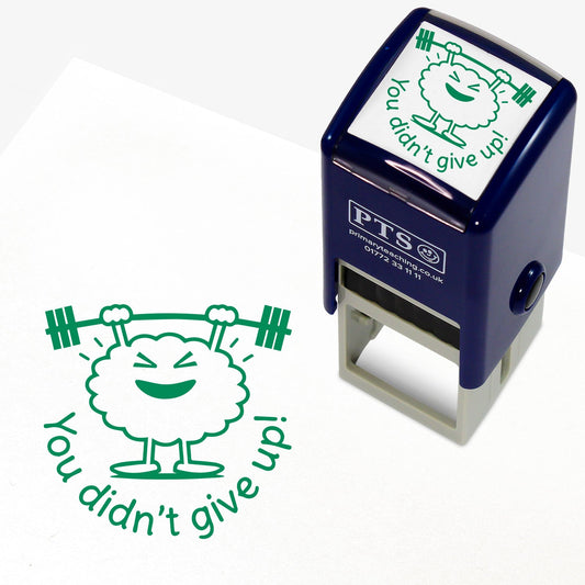 Green 25mm pre-inked stamper featuring a brain lifting weights above it's head with the phrase 'You didn't give up!' below.