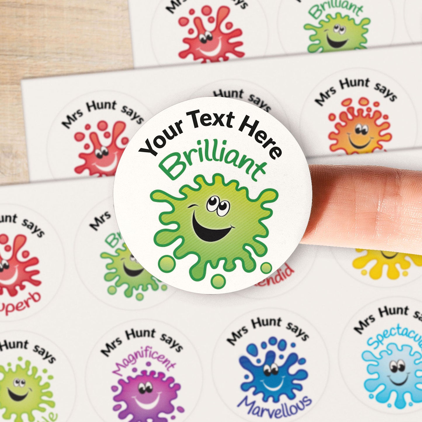 A close up image of a green splat on a sticker. Text around the character is customisable.