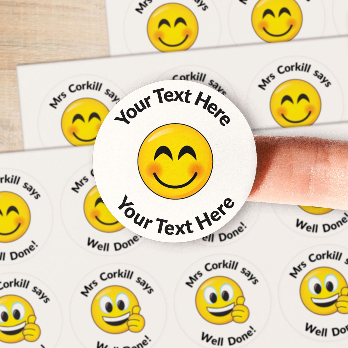 A close up image of an emoji sticker.  Text around the emoji is customisable.