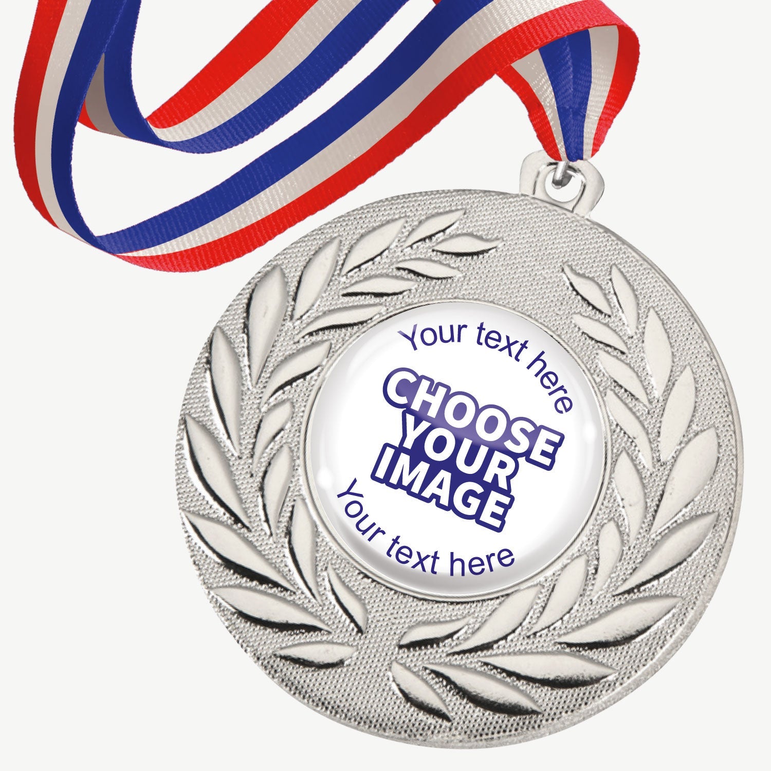 A set of ten silver-coloured metal medals, each featuring a central 25mm circular area for custom designs, encased in a clear, glossy dome; surrounded by a laurel wreath pattern and attached to a red, white and blue striped ribbon; designed for personalisation with text and images, ideal for sporting events and achievements.