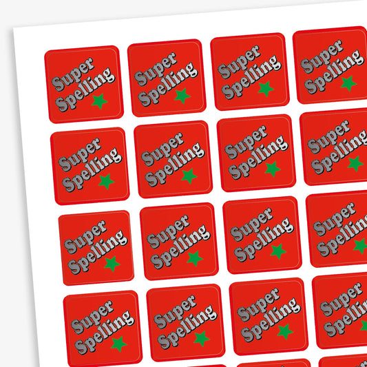 A sheet of 140 square 16mm reward stickers, each featuring the phrase 'Super Spelling' in  silver text diagonally set against a vibrant red background with a green star below.