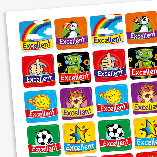 A sheet of square reward stickers, each with the word 'Excellent' in bold white text on a red and blue banner. The stickers feature colourful illustrations including rainbows, puffins, robots, thumbs-up icons, smiling suns, tigers, footballs, and stars. Each design has a bright background colour