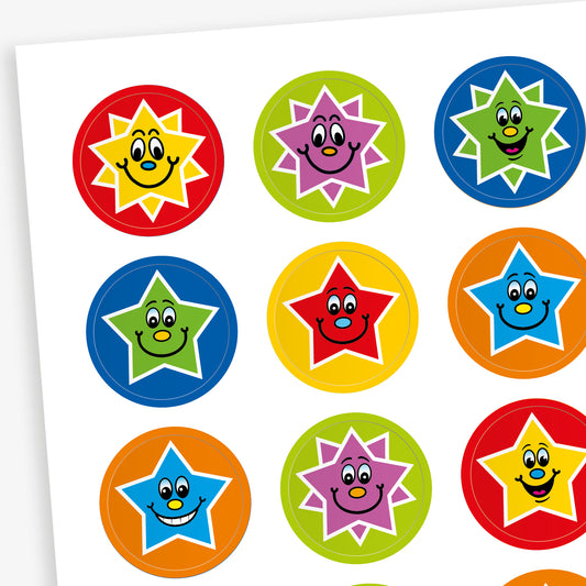 Sheet of colourful round stickers featuring smiling star characters in various colour combinations, including red, yellow, green, blue, purple, and orange. Each star has a cheerful facial expression and is set against a contrasting circular background.