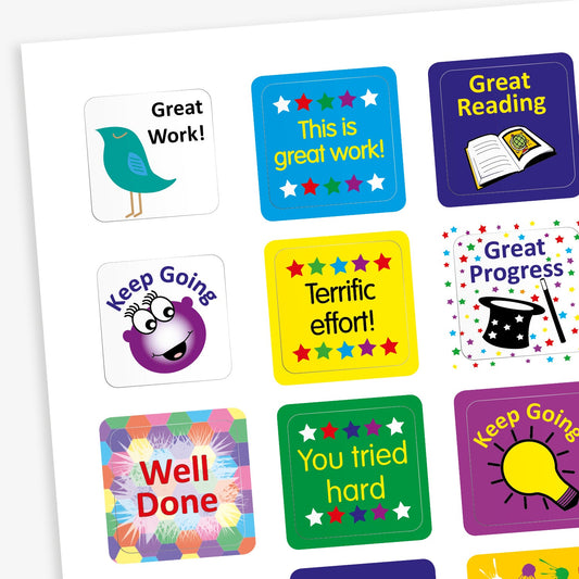A sheet of square reward stickers with phrases including 'Great Work', 'Keep Going', 'You Tried Hard' and 'Great Progress' in bold text. Each sticker features different images including an open book, a magicians hat and wand, a bird, light bulb or multicoloured background.