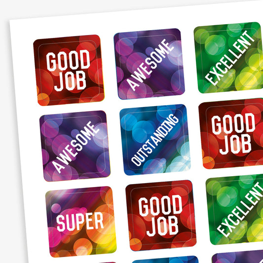 A sheet of square reward stickers with phrases including 'Good Job', 'Awesome', 'Excellent', 'Outstanding' and 'Super'.  The backgrounds are akin to lights through a rainy window and coloured red, purple, green and blue.