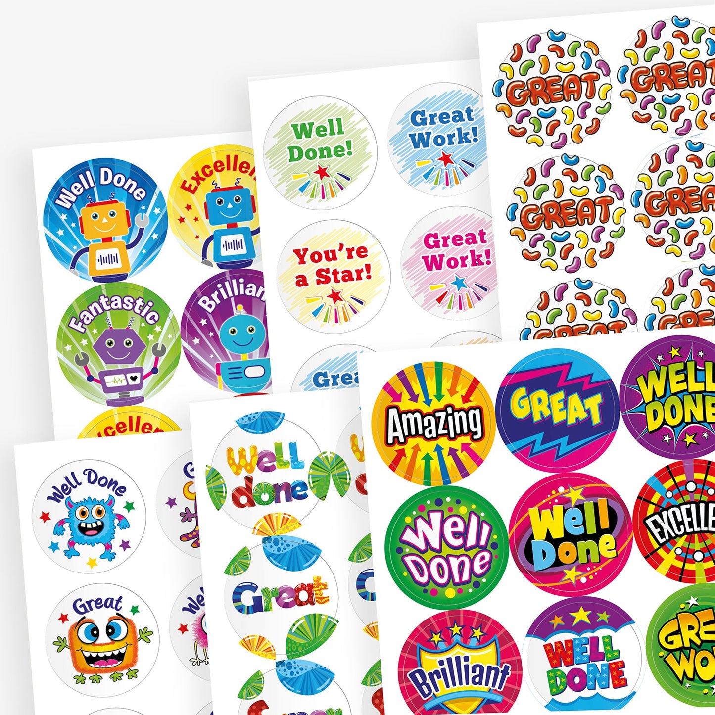 A mixed collection of colourful, scented reward sticker sheets featuring a variety of fun designs and motivational phrases. Messages include 'Well Done!', 'Great Work!', 'You're a Star!', 'Fantastic', 'Amazing', 'Brilliant', and 'Excellent'. Designs feature cartoon robots, stars, bold comic-style graphics, colourful lettering, and playful shapes to celebrate pupil achievements.