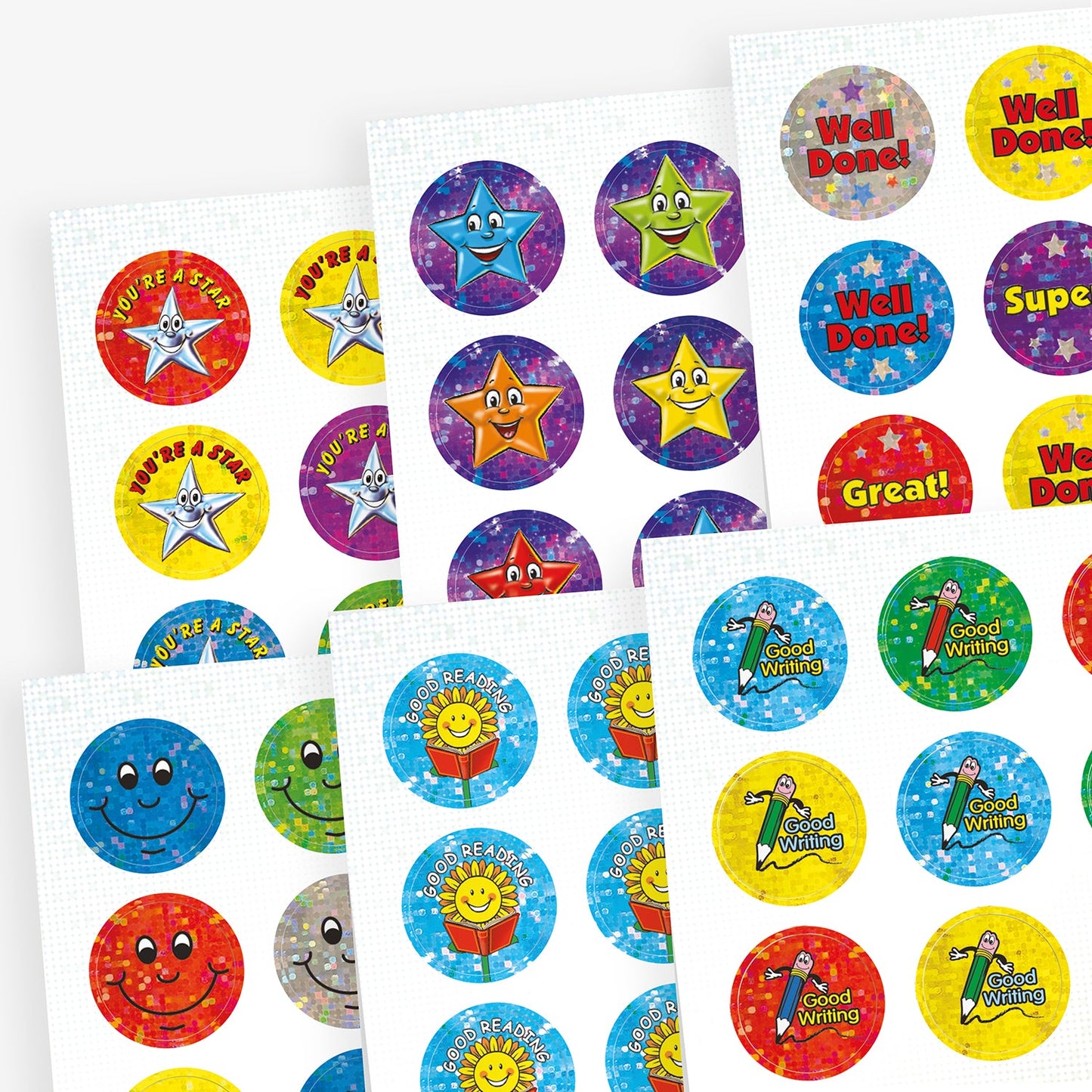 Selection of circular holographic stickers of varying colours forrewards.  Includes silver stars with 'You're a star', mutlicoloured stars on a starry background, a smiling pencil saying 'Good Writing' and a sunflower reading a book with 'Good Reading'.