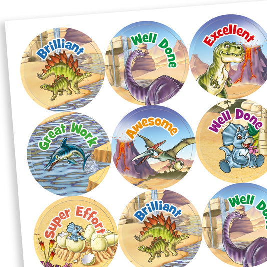 Sheet of muted coloured reward stickers featuring a variety of dinosaurs against a backdrop deserts, water and a volcano. Messages include 'Well Done', 'Awesome', 'Great Work' and 'Super Effort'