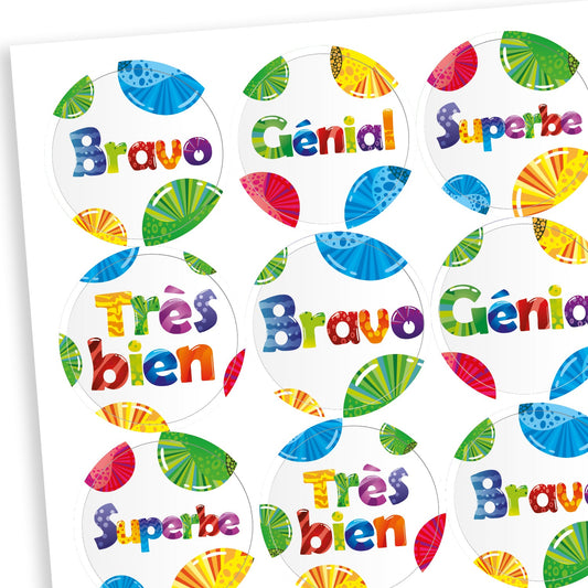 Sheet of bright coloured reward stickers edged with colourful fruit slices. Messages in French include 'Superbe' and 'Bravo!'.