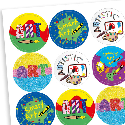 Sheet of round art-themed reward stickers with colourful designs and phrases such as 'ART', 'Smart Art', and 'Artistic'. Designs include paintbrushes, palettes and splashes in vibrant colours.