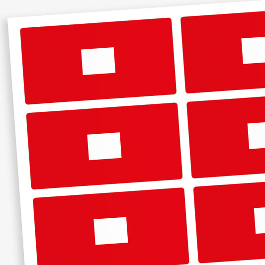 A set of 100 rectangular library labels, each measuring 72mm by 38mm, featuring a bold red background with a white central panel for handwritten or printed text; designed to assist in categorising and organising books within educational settings