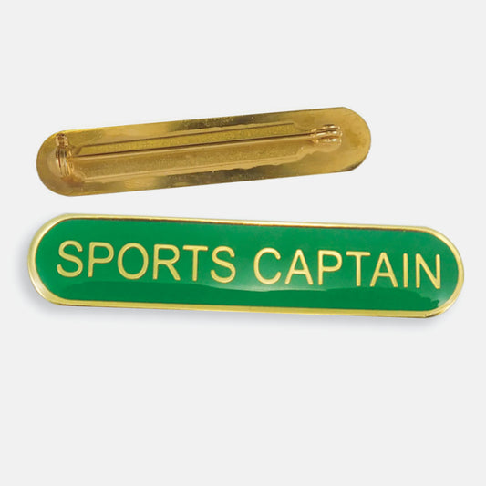 Green enamel badge in a long oval shape with a gold trim and the words 'SPORTS CAPTAIN' central in gold capital letters. The reverse side shows a gold back with a pin fastening