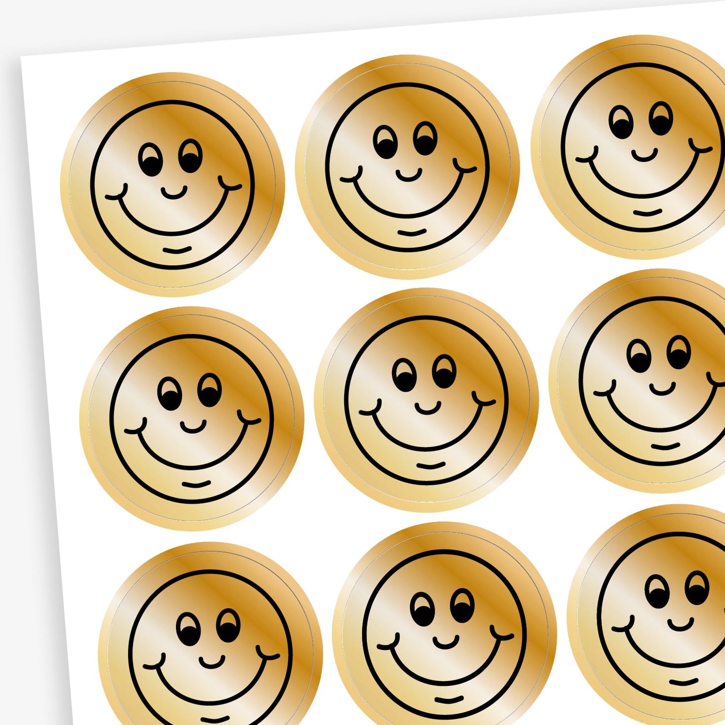 A sheet of metallic bronze stickers each with a smiling face as a black outline as it's design