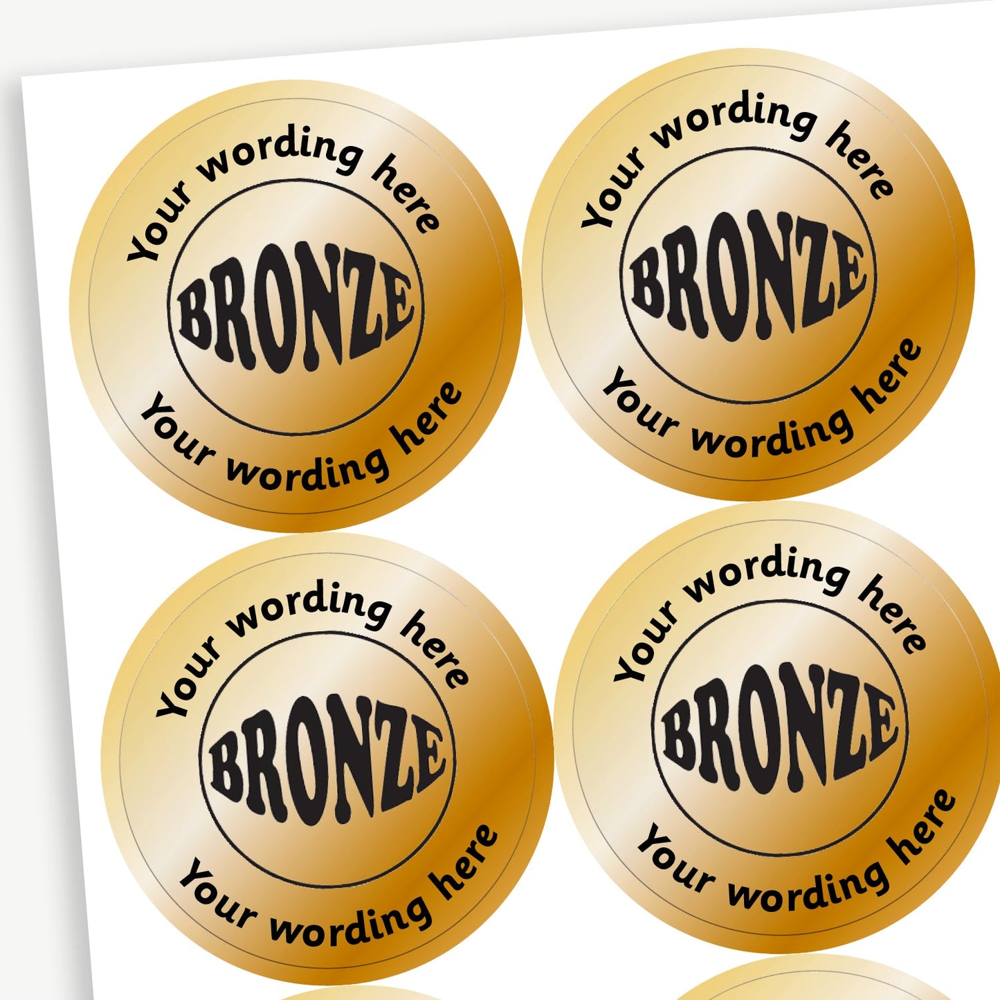 Sheet of 35 personalised 37mm circular stickers with a metallic bronze finish; each sticker features a bold 'BRONZE' in the centre, surrounded by the customisable text 'Your wording here' above and below, designed to reward pupils for achieving third place.