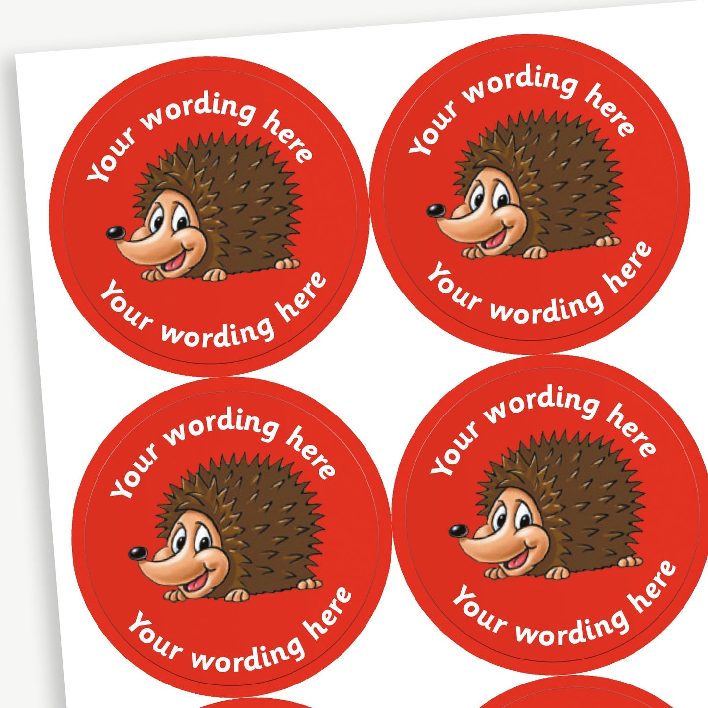 A sheet of customisable circular stickers featuring a hedgehog against a red background; includes customisable text above and below the image.