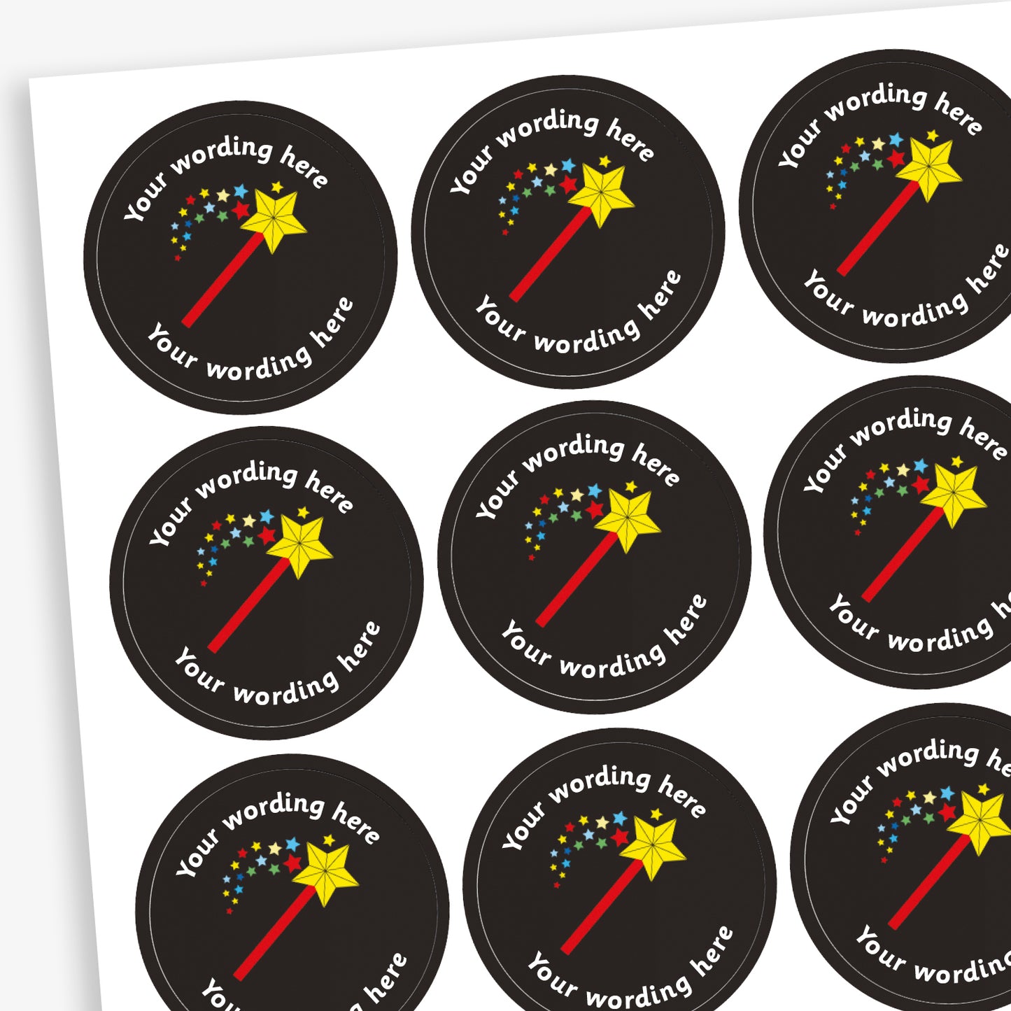 A sheet of circular, black reward stickers featuring a wand emitting a shower of stars. Placeholder text above and below 'Your wording here' indicate customisation options.