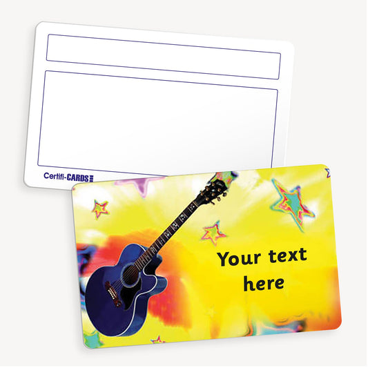 Personalised Guitar CertifiCARD featuring a vibrant yellow background with multicoloured stars and a prominent blue guitar illustration. The front side includes the placeholder text 'Your text here' in bold black letters, allowing for customisation. The reverse side displays two white boxes for handwritten recipient details. The card measures 86mm x 54mm and is designed for rewarding musical achievements.
