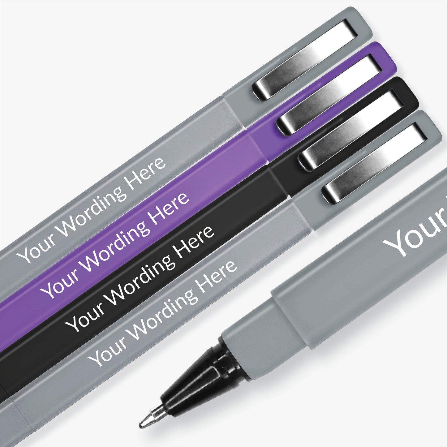 4 pens: purple, black, and two in grey; square barrelled, textured ball point pen with brushed metal clip on the lid. Placeholder text 'Your Wording Here' on the barrel