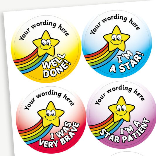 Four colourful circular reward stickers featuring smiling yellow stars with rainbow trails. Top left: Yellow sticker with the text 'Well Done!'. Top right: Blue sticker with 'I'm a Star!'. Bottom left: Red sticker with 'I Was Very Brave'. Bottom right: Purple sticker with 'I'm a Star Patient'. Each sticker includes placeholder text at the top reading 'Your wording here'.