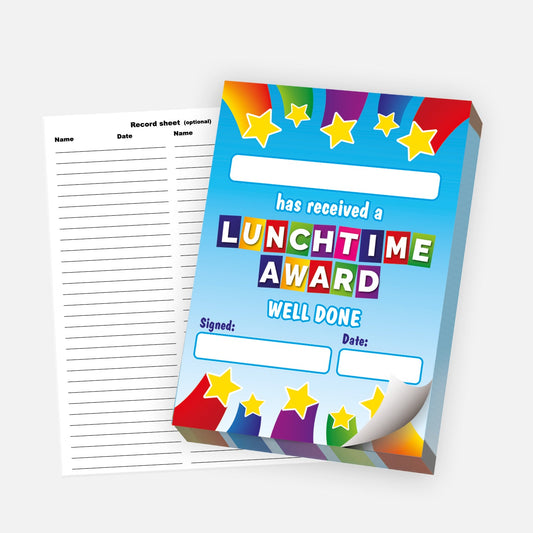 A colourful 'Lunchtime Award' certificate pad with a vibrant blue background, decorated with stars and rainbow bursts at the top and bottom. The text reads 'has received a LUNCHTIME AWARD – WELL DONE', with spaces to add a recipient’s name, the signature, and the date. A lined record sheet is shown beside the pad, with columns for recording names and dates. The pad is partially peeled to show it's a tear-off design.