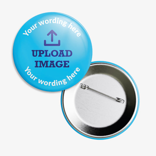 Circular badge with blue background, featuring placeholder text 'Your wording here' at the top and bottom. The centre displays a sample image area labelled 'UPLOAD IMAGE', indicating customisable space for a personal image or logo. The badge is accompanied by a rear view showing a metal pin fastening.