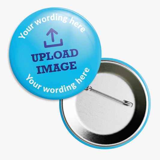 Circular badge with blue background, featuring placeholder text 'Your wording here' at the top and bottom. The centre displays a sample image area labelled 'UPLOAD IMAGE', indicating customisable space for a personal image or logo. The badge is accompanied by a rear view showing a metal pin fastening.