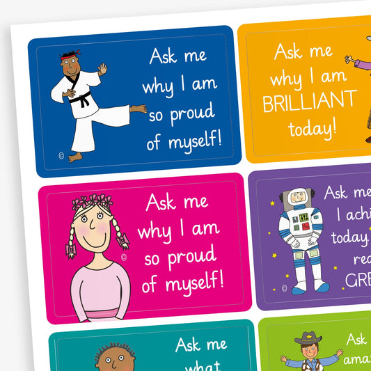 A sheet of 46mm x 30mm rectangular 'Ask Me' stickers featuring colourful cartoon characters with phrases like 'Ask me why I am so proud of myself!' and 'Ask me why I got this sticker!' in bold white text. Designed to encourage pupil engagement and conversation