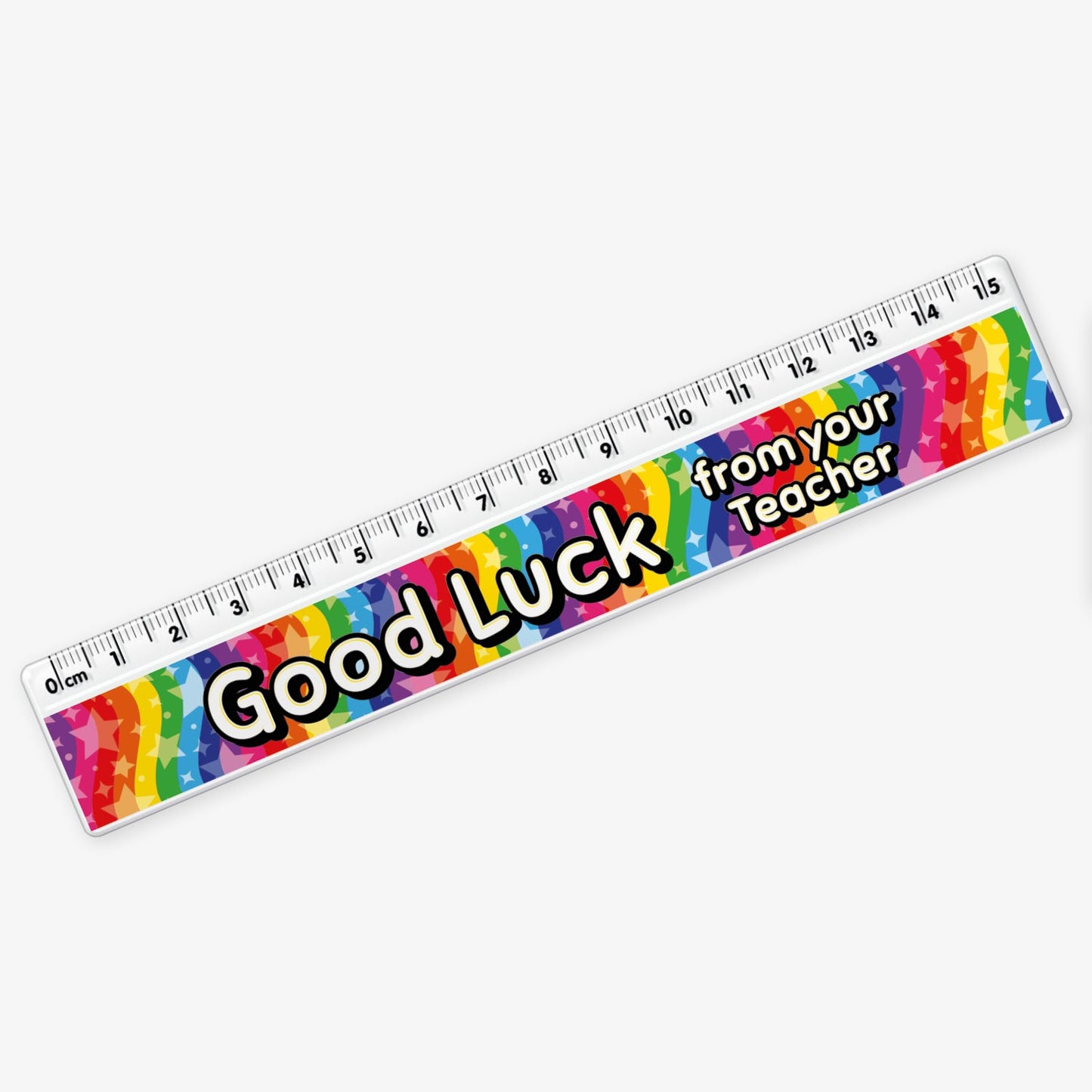 15cm ruler featuring a vibrant rainbow background with stars and bold yellow and white text reading 'Good Luck from your Teacher' along the centre.