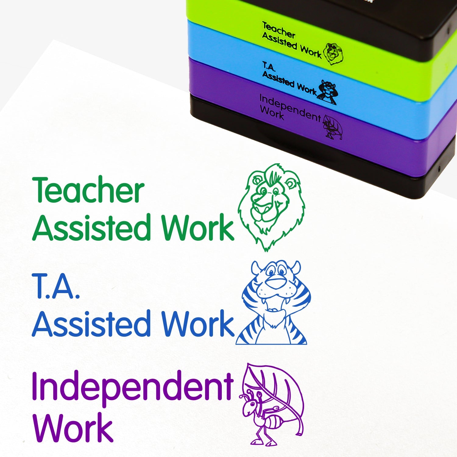 3 stacked rectangular self-inking stampers measuring 44mm by 13mm, featuring the imprint - 'Teacher Assisted Work' with a lions face in green ink; 'T.A. Assisted Work' with a smiling tiger face in blue ink; 'Independent Work' with an ant carrying a leaf on it's back in purple ink