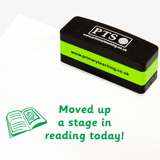 Rectangular self-inking stamper with green ink measuring 44mm by 13mm, featuring, across three lines, the phrase 'Moved up a stage in reading today!' next to an open book with lines on the left page and a picture of a globe on the right page.