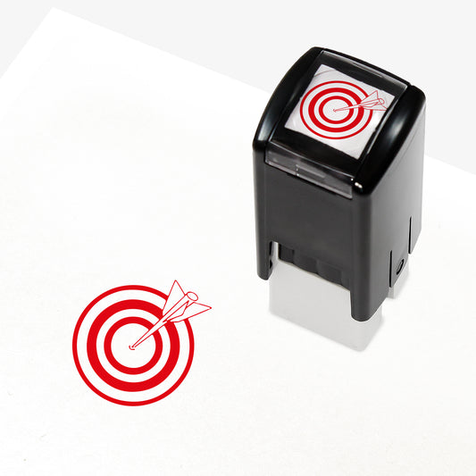 Target Stamper featuring a compact black casing with a red bullseye and arrow design. The stamp imprint measures 10mm in diameter and is available in various ink colours, ideal for marking pupil achievements.