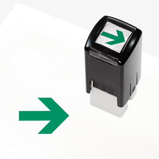 A 10mm self-inking stamp with a green right-pointing arrow design central to the design