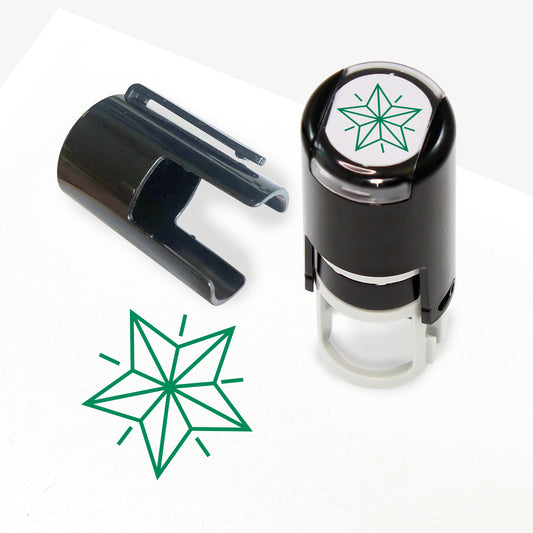 A 10mm self-inking stamp with a green outline 3D style star central to the design.  The stamper lid also shows a clip for attaching the stamper to a lanyard.