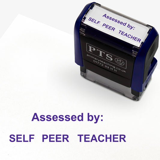 A rectangular self-inking stamper with a dark blue casing, displaying the purple text 'Assessed by:' and 'SELF   PEER   TEACHER'; the stamped impression measures 38mm by 15mm