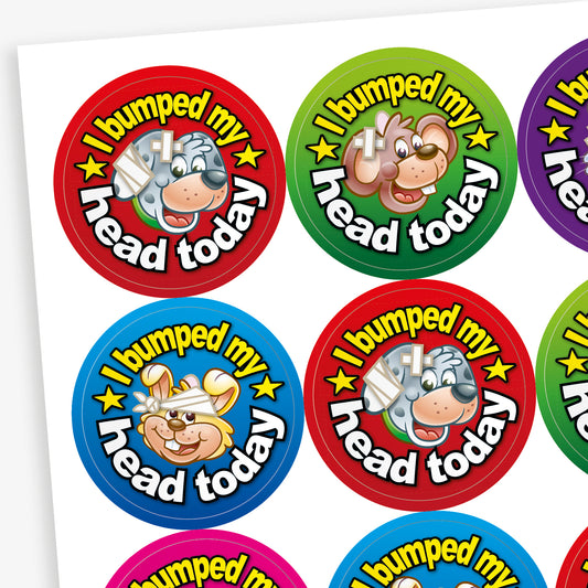 Sheet of vibrant coloured stickers with a dog central to the image with a bandaged  head.  There is text surrounding the image saying 'I bumped my head today!'