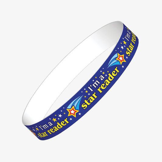 A set of ten bluewristbands featuring the phrase 'I'm a star reader' in bold yellow text, accompanied by shooting star illustrations; designed to reward pupils for their reading achievements in educational settings.