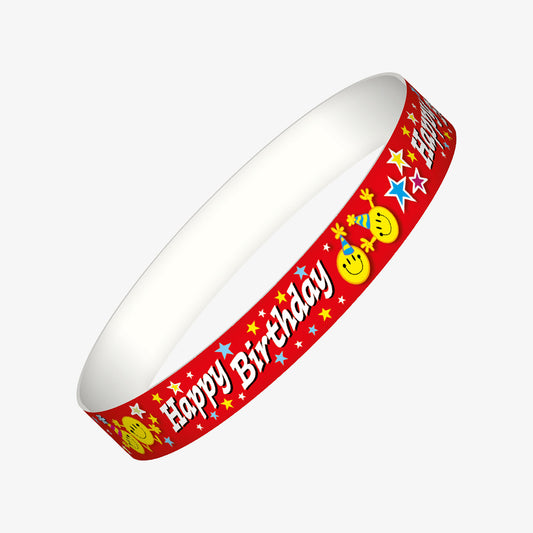 A set of ten red wristbands featuring the phrase 'Happy Birthday' in bold white letters, accompanied by cheerful yellow smiley faces wearing party hats and surrounded by colourful stars; designed to celebrate pupils' birthdays in a fun and engaging manner.